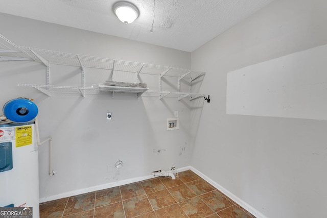 clothes washing area featuring hookup for a washing machine, baseboards, laundry area, water heater, and hookup for a gas dryer