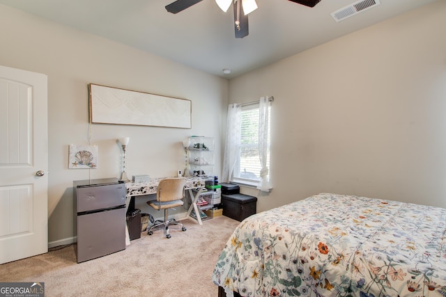 516 Grand Magnolia St, Jackson, GA 30233 - carpeted bedroom with a desk, freestanding refrigerator, and a ceiling fan