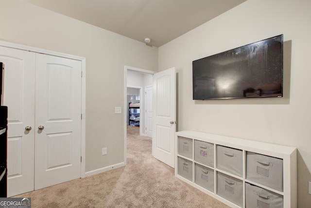 516 Grand Magnolia St, Jackson, GA 30233 - unfurnished bedroom featuring light colored carpet, baseboards, and a closet