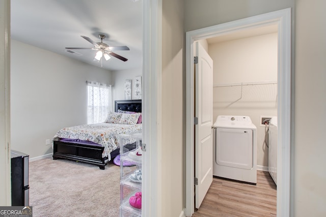 516 Grand Magnolia St, Jackson, GA 30233 - bedroom with baseboards, ceiling fan, and independent washer and dryer