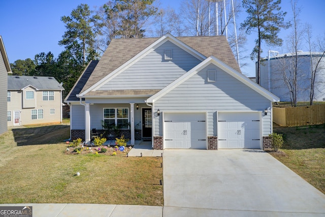 516 Grand Magnolia St, Jackson, GA 30233 - traditional-style house with a garage, brick siding, driveway, covered porch, and a shingled roof