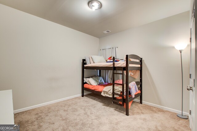 516 Grand Magnolia St, Jackson, GA 30233 - bedroom with carpet floors and baseboards