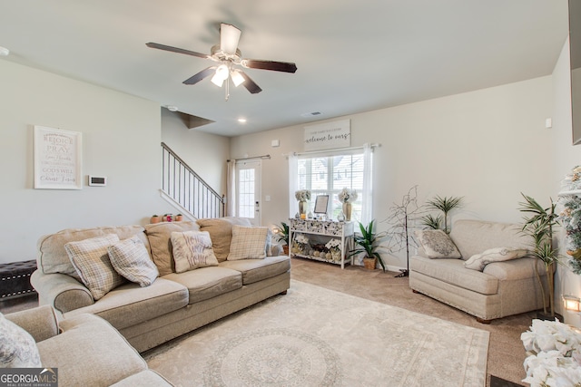 516 Grand Magnolia St, Jackson, GA 30233 - carpeted living area featuring stairs and a ceiling fan