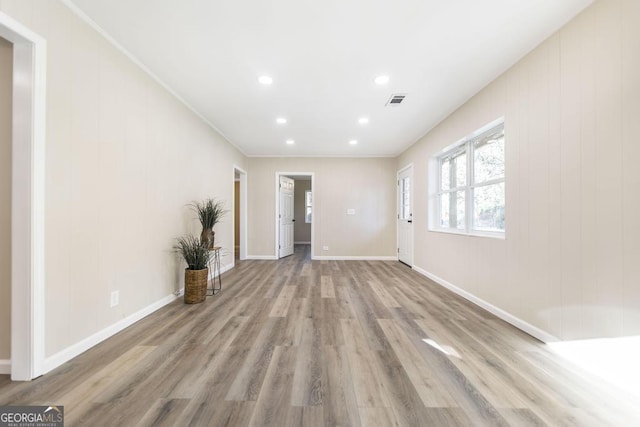 unfurnished living room featuring visible vents, recessed lighting, baseboards, and wood finished floors