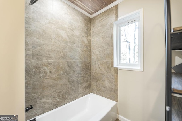 bathroom featuring shower / washtub combination and ornamental molding