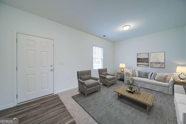 living room with dark wood-style floors and baseboards