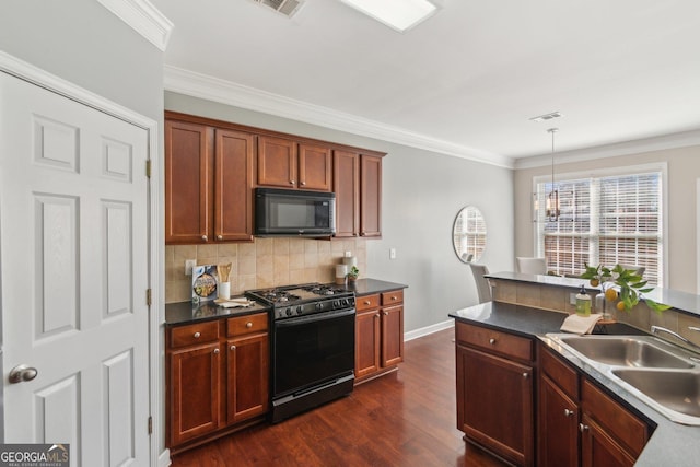 kitchen featuring visible vents, black appliances, backsplash, dark countertops, and crown molding