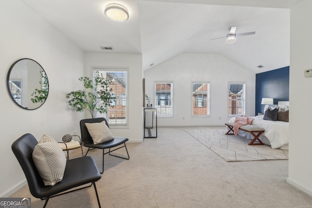 living area with visible vents, lofted ceiling, baseboards, and carpet flooring