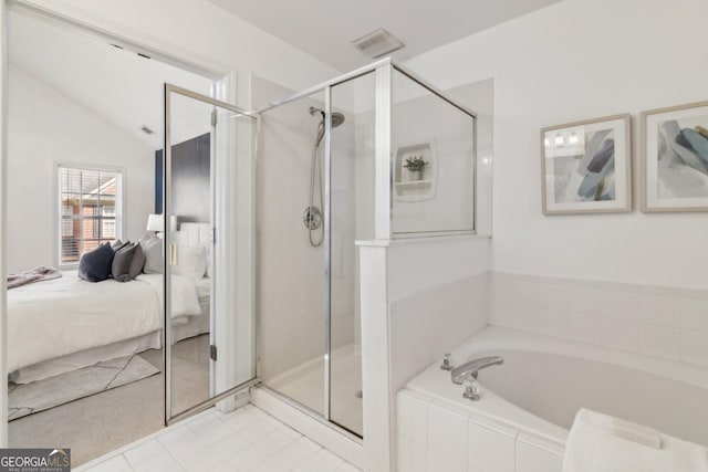 full bath with visible vents, lofted ceiling, a shower stall, a garden tub, and connected bathroom