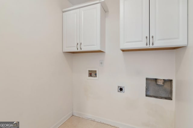 clothes washing area featuring washer hookup, cabinet space, baseboards, and hookup for an electric dryer