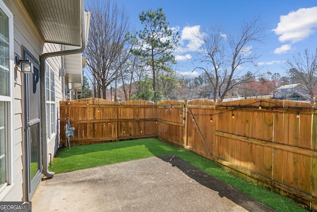 view of yard featuring a patio area and fence