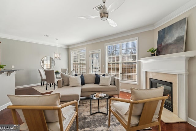 living area featuring visible vents, a fireplace, dark wood-type flooring, and baseboards