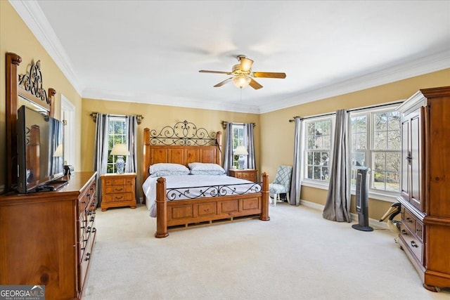 bedroom featuring a ceiling fan, baseboards, light colored carpet, and crown molding