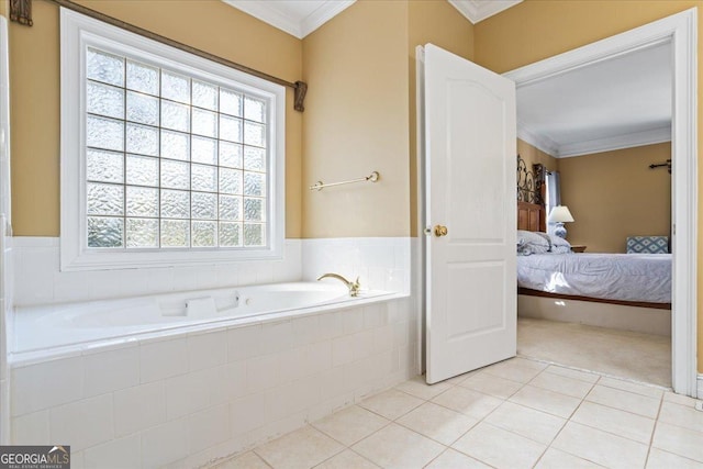 ensuite bathroom with tile patterned flooring, ornamental molding, ensuite bathroom, and a bath