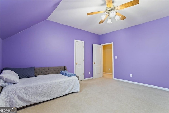 carpeted bedroom featuring baseboards, lofted ceiling, and ceiling fan