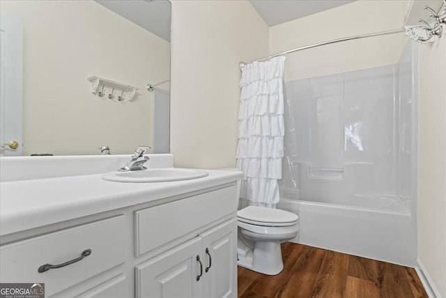 full bathroom with toilet, wood finished floors, vanity, and shower / bath combination with curtain