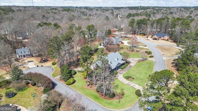 drone / aerial view with a view of trees