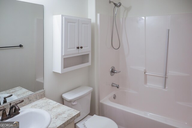 full bathroom with vanity, shower / tub combination, and toilet