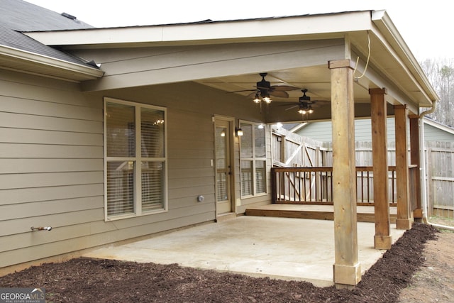 view of patio / terrace with a ceiling fan and fence