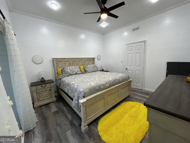 1550 Shady Oaks Ln, Greensboro, GA 30642 - bedroom with ornamental molding, a ceiling fan, dark wood-type flooring, and visible vents
