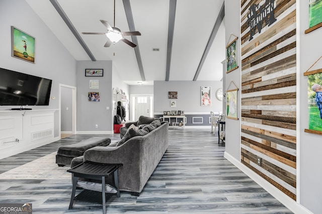 living area featuring a ceiling fan, baseboards, visible vents, high vaulted ceiling, and dark wood-style flooring