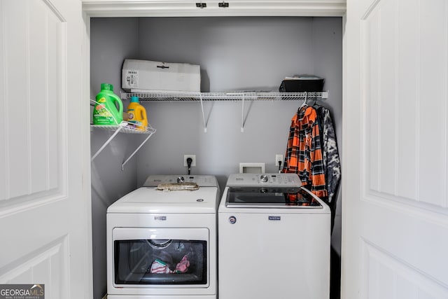 laundry room featuring laundry area and washer and clothes dryer