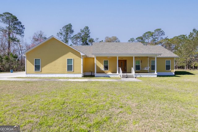 back of house featuring a lawn and ceiling fan