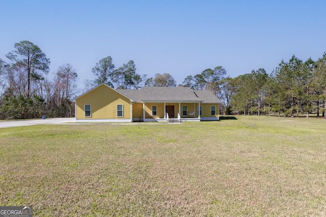 view of front of property with a porch and a front yard