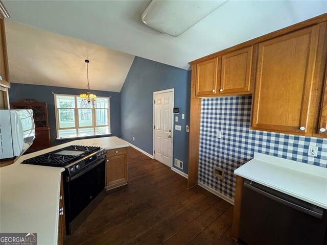 kitchen with gas range, light countertops, vaulted ceiling, a notable chandelier, and dark wood-style flooring