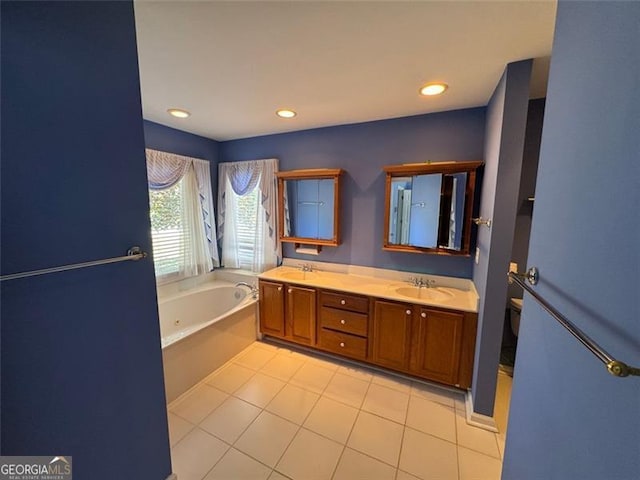 full bath with a jetted tub, toilet, double vanity, recessed lighting, and a sink