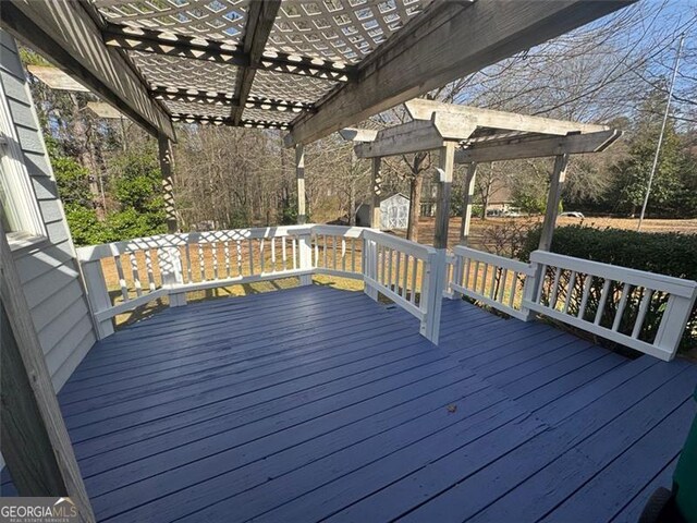 wooden deck with a pergola