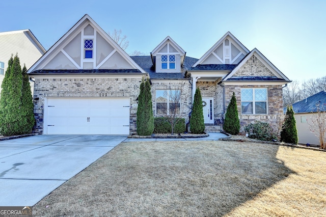 view of front of property featuring brick siding, driveway, and a garage