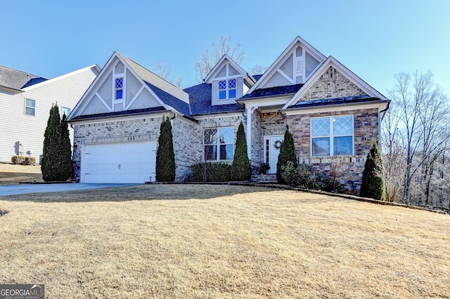 craftsman inspired home with stone siding, concrete driveway, an attached garage, and a front lawn