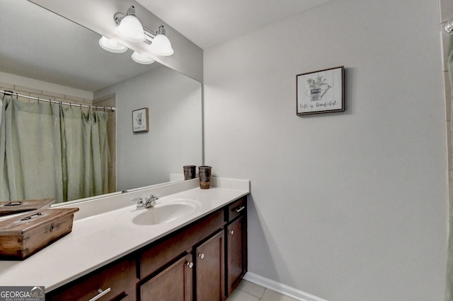 full bath featuring baseboards, a shower with shower curtain, tile patterned flooring, and vanity