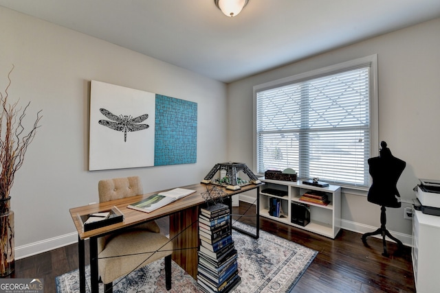 home office featuring baseboards and wood finished floors