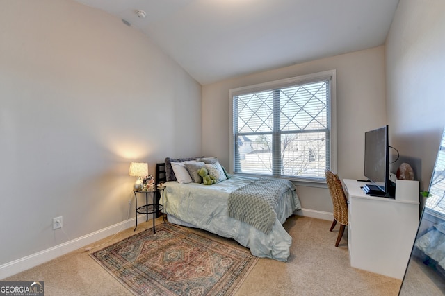 bedroom with baseboards, carpet flooring, and vaulted ceiling