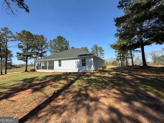 rear view of house with a lawn