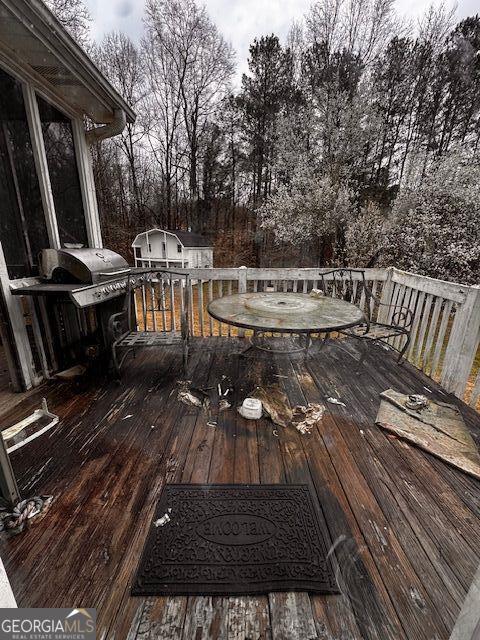 wooden deck featuring an outdoor structure