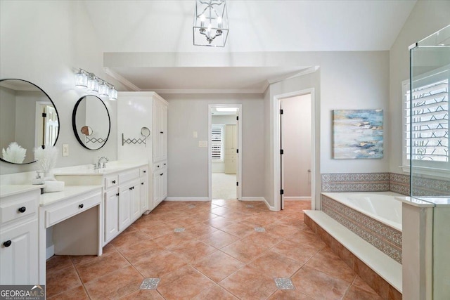 bathroom featuring tile patterned flooring, vanity, a bath, crown molding, and baseboards