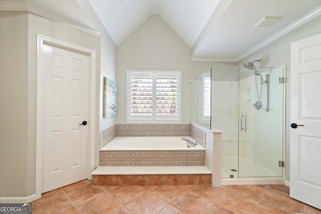 full bath featuring vaulted ceiling, tile patterned floors, a stall shower, a bath, and visible vents