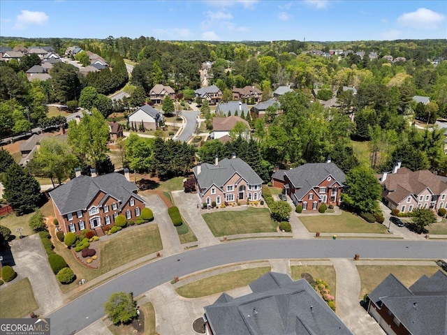 birds eye view of property with a residential view