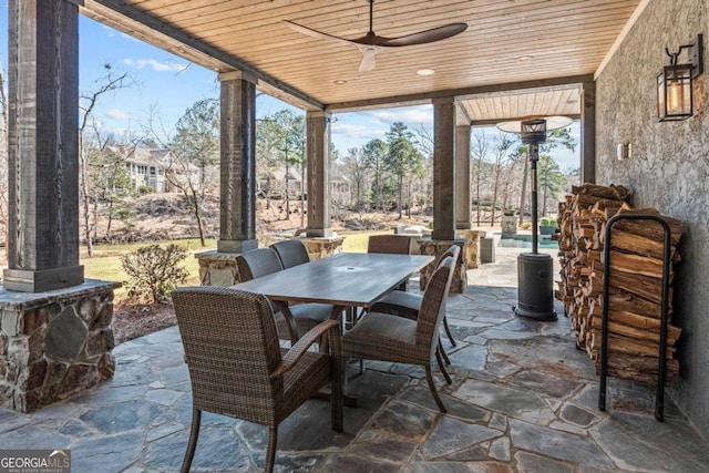 view of patio / terrace featuring outdoor dining space and ceiling fan