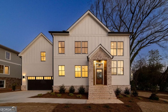 modern farmhouse style home with board and batten siding, an attached garage, and driveway