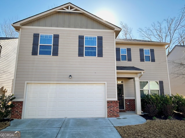 view of front of home with brick siding, a garage, driveway, and board and batten siding