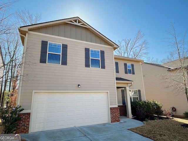 view of front of property featuring board and batten siding, concrete driveway, a garage, and brick siding