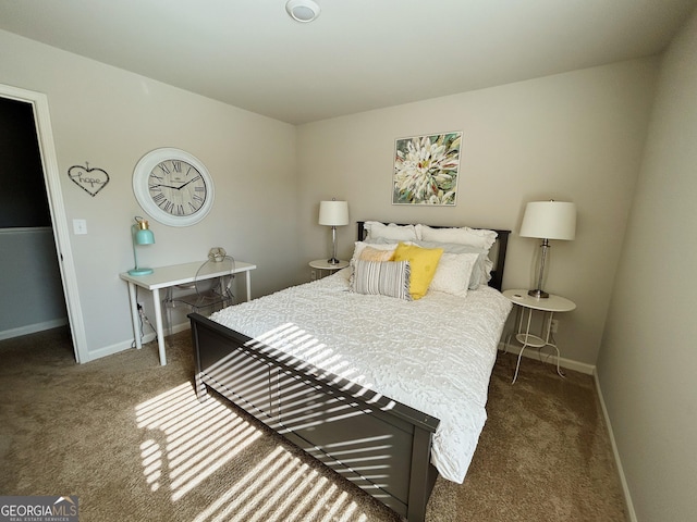 bedroom featuring baseboards and carpet floors