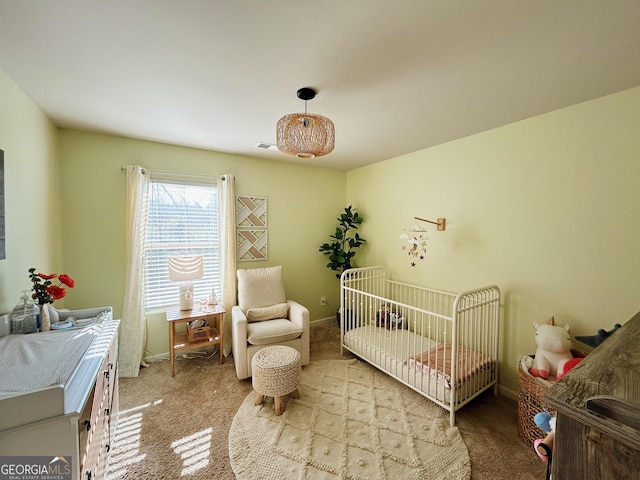 carpeted bedroom with visible vents and baseboards