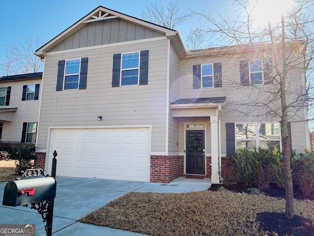 view of front facade featuring a garage, brick siding, board and batten siding, and driveway