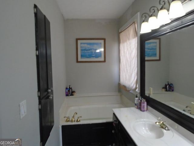 full bathroom featuring vanity and a garden tub