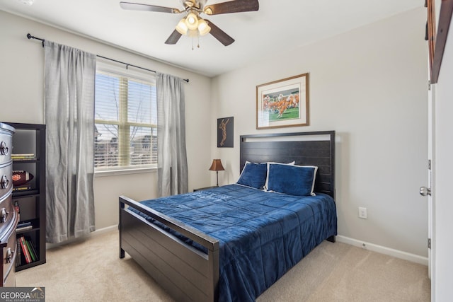 carpeted bedroom featuring a ceiling fan and baseboards